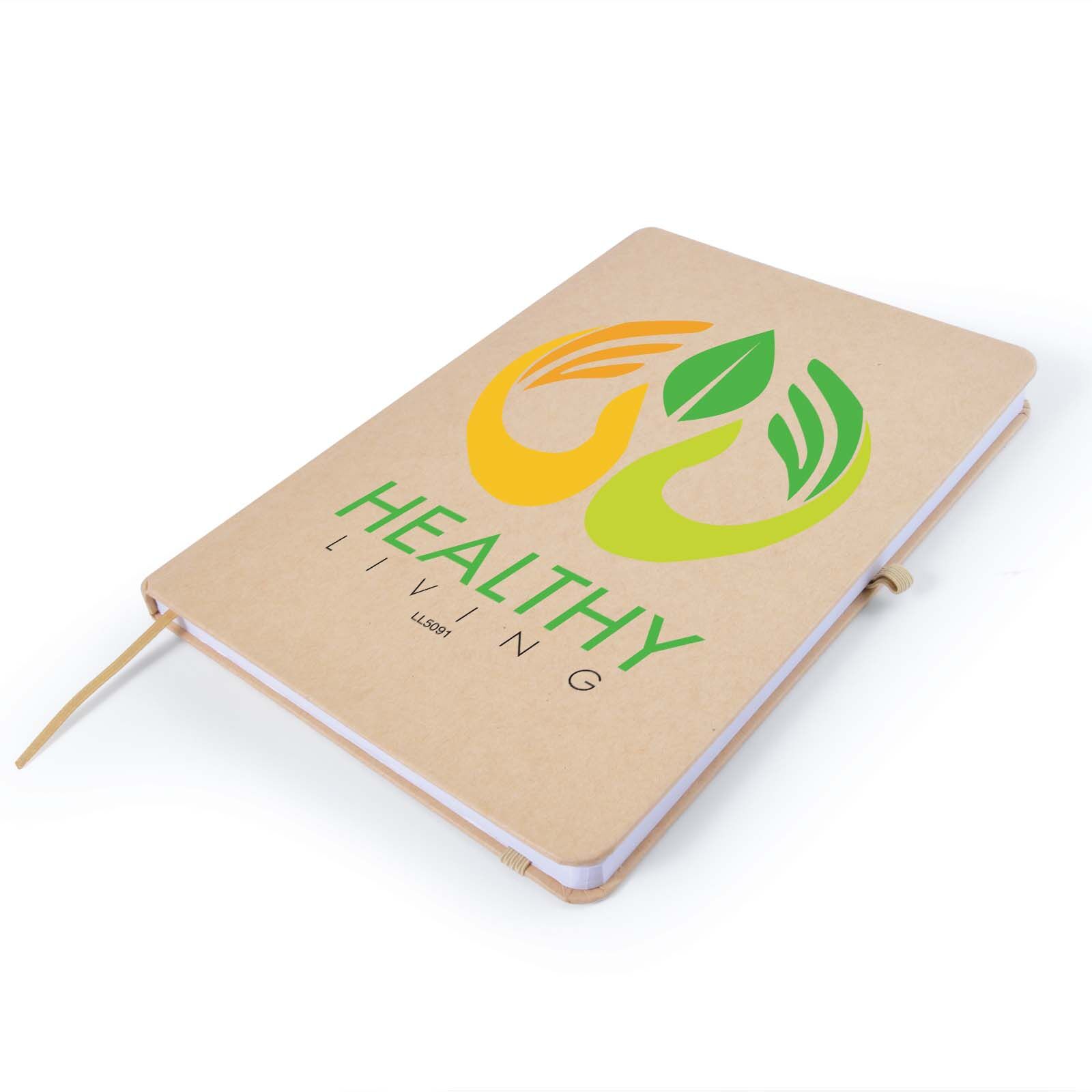 Healthy Living logo printed via embroidery and heat transfer vinyl on a softcover notebook.